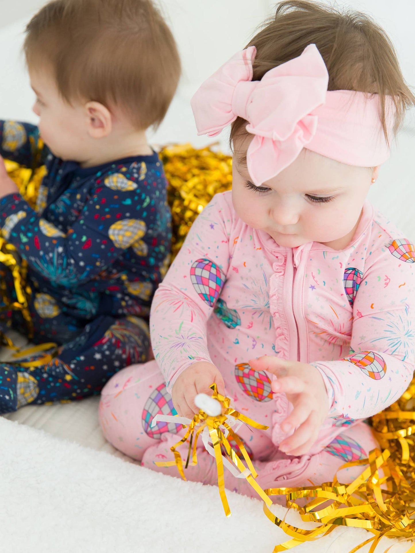 RuffleButts + RuggedButts - Baby Girls Pink Happy New Year Bamboo Viscose Footed Ruffle One Piece Pajama