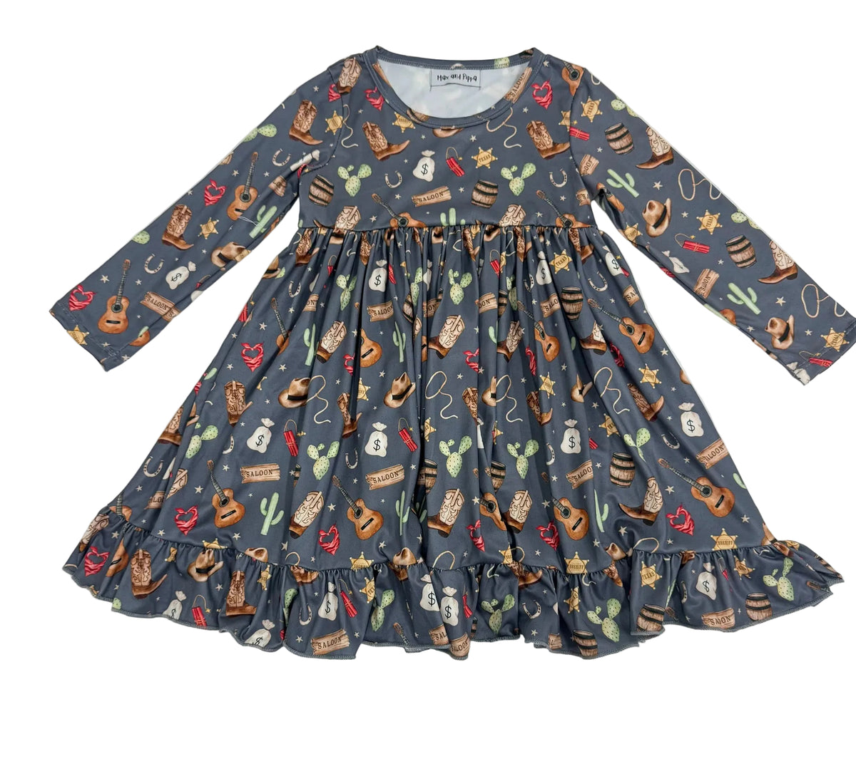 A long-sleeve children's dress with a gathered waist and ruffled hem, featuring a western-themed print of cacti, cowboy boots, lasso ropes, stars, and hats on a slate blue-gray background.
